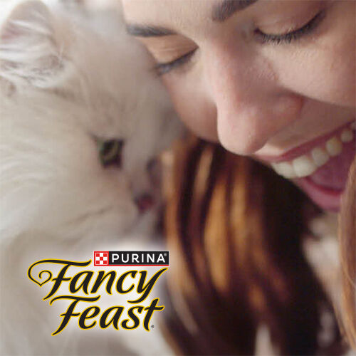 Fancy Feast - smiling girl and cat head to head