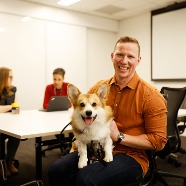 Purina staff member with his dog