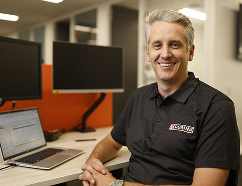 Purina Australia employee at his desk