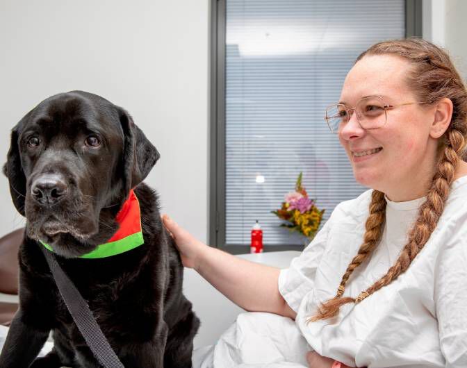 Delta Therapy dog with a patient