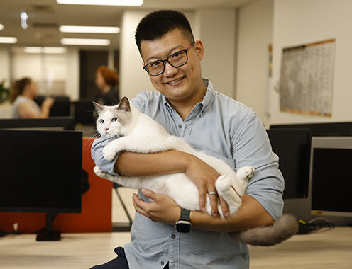 Purina employee with his cat