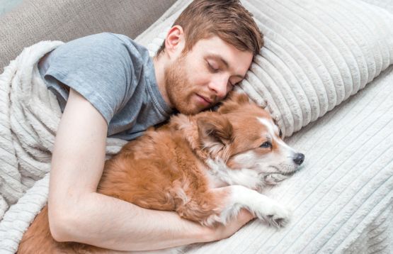 Man and dog sleeping