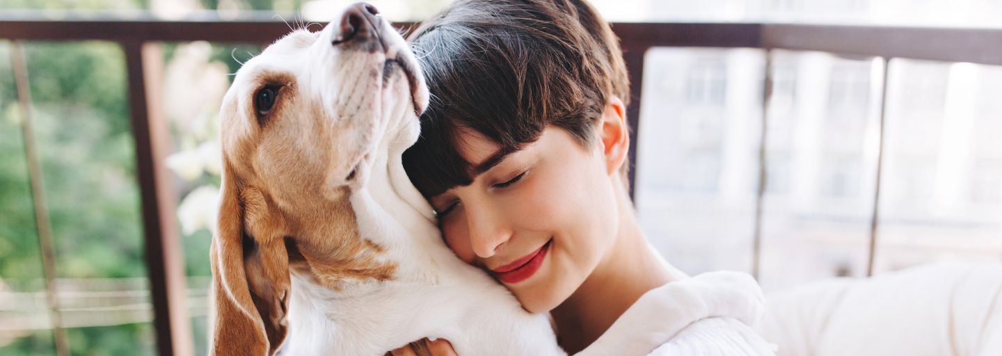 Woman hugging dog